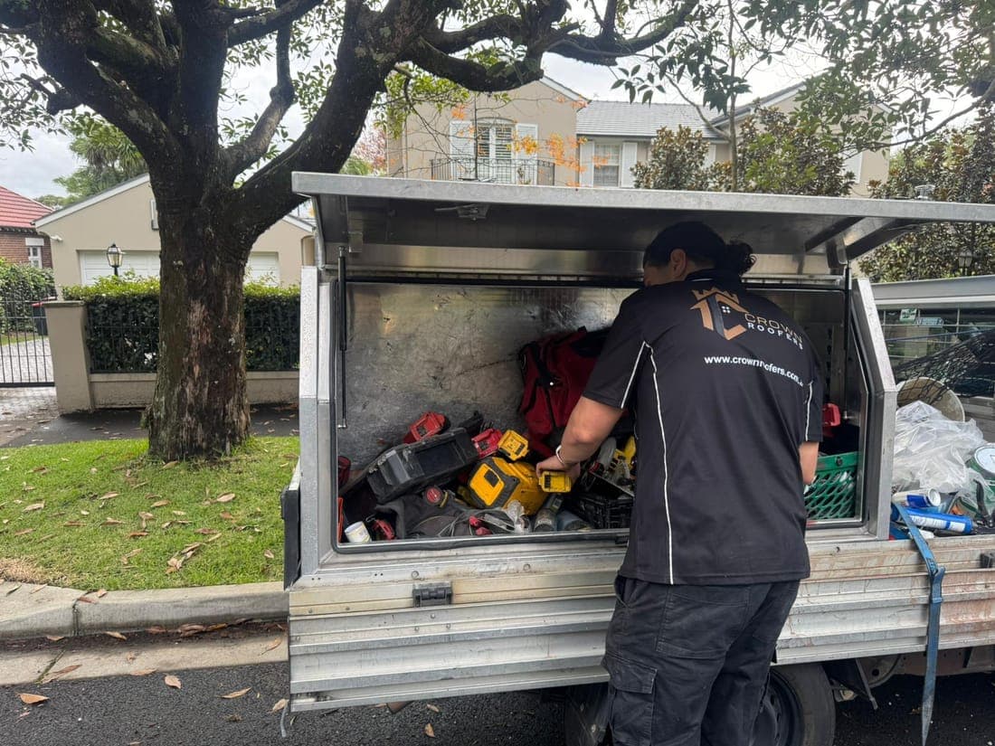 Crown Roofers branded work vehicle and roofing equipment